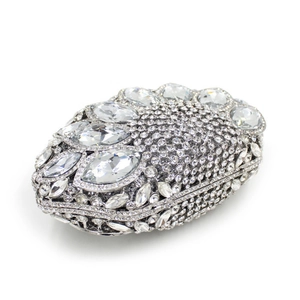Macro shot of silver evening clutch featuring intricate crystal and marquise rhinestones