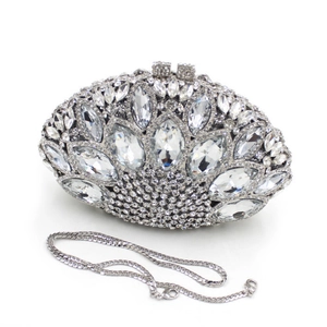 Detail of silver evening clutch with sparkling crystals and metal chain strap