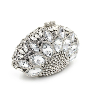 Macro shot of silver rhinestone evening bag showing intricate marquise crystal patterns
