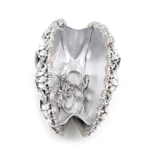Detail view of silver rhinestone evening bag with chain strap and spare crystals