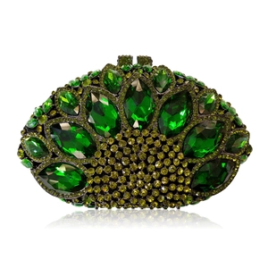Detail of green marquise crystals and rhinestones on luxury hollow metal evening clutch