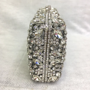 Detailed close-up of hollow metal evening bag with sparkling crystal rhinestones
