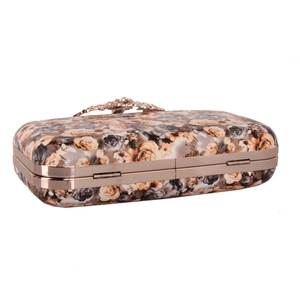 Close-up of floral rose print evening clutch bag with crystal flower clasp and gold metal frame