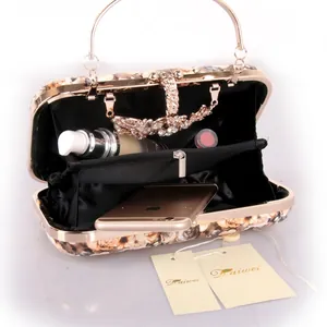 Floral print evening clutch bag with gold handle and vintage rose pattern design