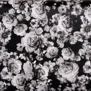 Close-up of the vintage black and white rose floral print on pebble grain leather