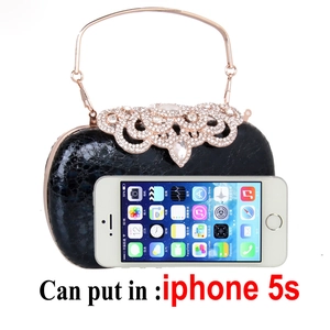 Detail view of black rhinestone evening clutch bag capacity showing phone fit