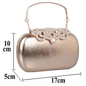 Detailed view of champagne gold evening clutch with rhinestones and 17x10x5cm dimensions