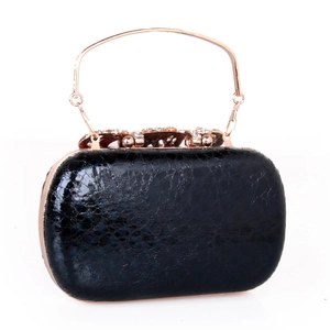 Detailed view of black faux leather evening clutch with rose gold handle and diamond clasp