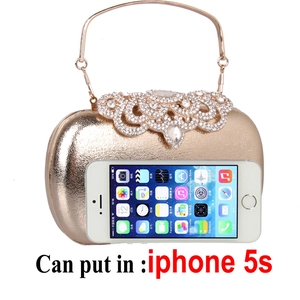 Champagne gold evening clutch bag with ornate rhinestone crystals and metal handle