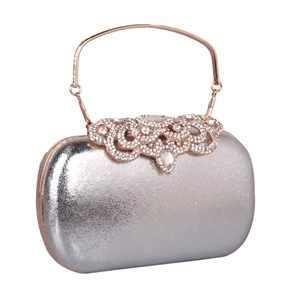 Detailed macro of silver pebble leather evening clutch bag with crystal rose gold pattern
