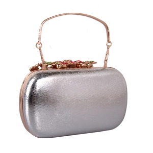 Silver hard shell evening clutch with rose gold ring handle and crystal floral clasp