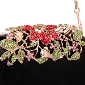 Black leather evening clutch bag with ornate floral crystal decoration and gold handle
