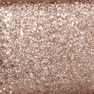 Macro detail of champagne gold glitter fabric for luxury evening clutch bags