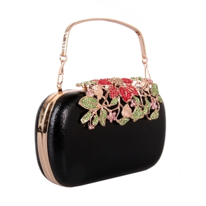 Detail of luxury evening clutch with rose gold frame and floral rhinestone inlay