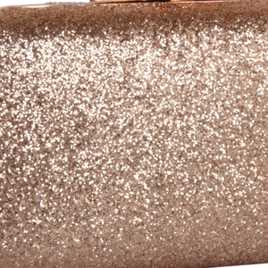 Macro detail of rose gold sequin material on an elegant evening clutch bag