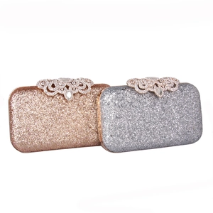 Champagne gold and silver glitter dinner clutch bags with crystal encrusted metal clasps