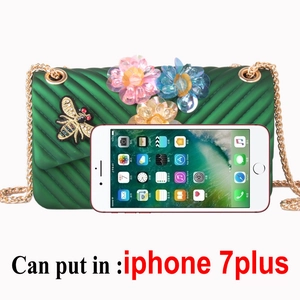 Green silicone crossbody bag with 3D floral accents and chain strap for women