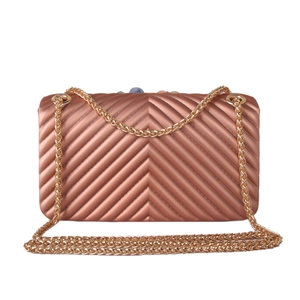 Detail view of rose gold silicone chain bag featuring elegant V-shaped quilted texture