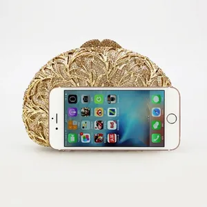 Golden hollow leaf crystal evening clutch bag with iPhone 6s for size reference