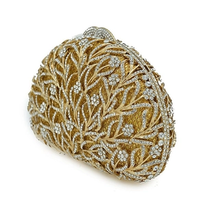 Detailed side view of a gold floral crystal clutch bag with sparkling rhinestones