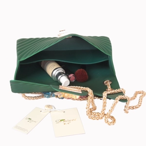 Emerald green jelly crossbody bag with floral texture, golden chain and spacious interior