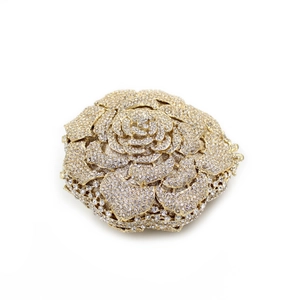 Pochette de soirée rose dorée avec métal ajouré complexe et incrustations de cristaux