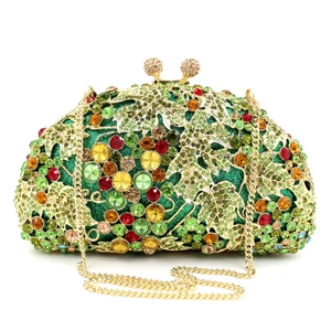 Macro detail of luxury grape cluster evening clutch with colorful rhinestones and gold leaf
