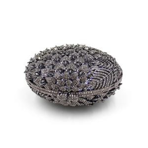 Detail of grey rhinestone evening bag with intricate feather pattern and metal closure