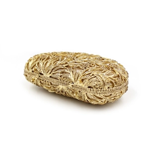 Detail of golden hollow metal clutch featuring sparkling rhinestones for formal evening events