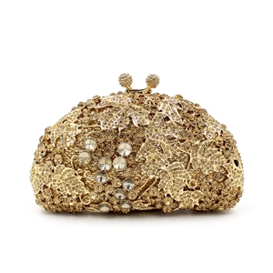 Exquisite gold metal clutch bag with crystal grape patterns and rhinestone embellishments