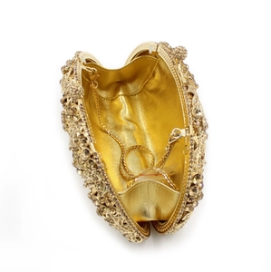 Detailed interior of champagne rhinestone evening clutch with gold metal chain strap