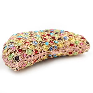 Macro detail of luxury evening clutch bag with colorful crystals and gold metal frame