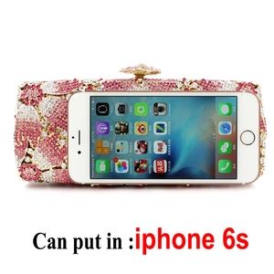 Detail view of crystal evening clutch bag capacity showing fit for a smartphone