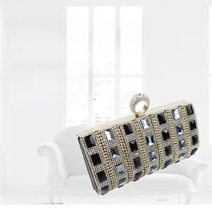 Close-up of sparkling crystals and ring clasp on a luxury hard shell evening bag