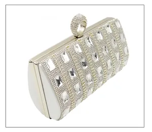 Side view of luxury silver evening clutch bag with rectangular rhinestones and ring clasp