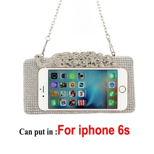 Detailed view of silver peacock evening clutch size compared to an iPhone 6s