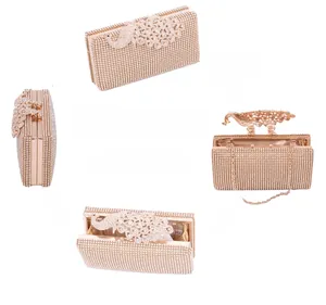 Detailed views of luxury peacock clutch bag with champagne rhinestones and chain strap