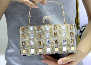 Luxurious evening clutch bag with sparkling rhinestones and crystal ring handle closure
