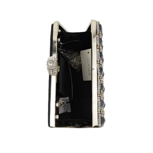 Detail view of the black satin interior with silver chain strap and sparkling rhinestones