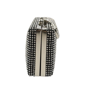 Macro detail of luxury evening clutch with crystal rhinestones and leopard clasp