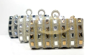 Three elegant clutch bags in gold and silver with rhinestones and crystal details