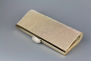 Luxurious champagne gold rhinestone evening clutch bag with sparkling metal frame