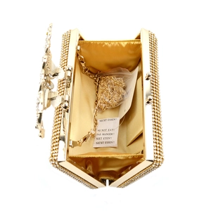 Top view of the peacock evening bag showing gold satin lining and detachable chain