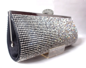 Detail view of silver rhinestone evening bag with luxury crystal mesh and metal frame
