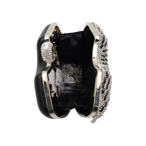 Detail view of the black rhinestone evening bag interior with silver metal chain strap