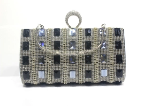 Detail of evening clutch featuring crystal rhinestones and blue gem embellishments