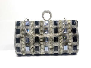 Detailed close-up of a luxury geometric rhinestone evening bag with elegant ring clasp
