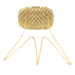Pochette de soirée dorée avec strass, relief floral et pompons en diamants