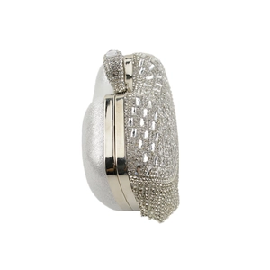 Side view detail of silver heart-shaped evening clutch with sparkling rhinestones