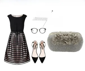 Silver evening clutch with crystal leaf floral design styled with a black striped dress